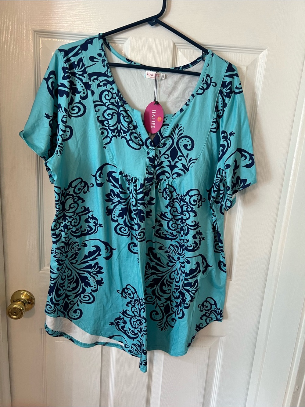 Alife Turquoise Short Sleeve V-Neck Top with Navy Floral Motif